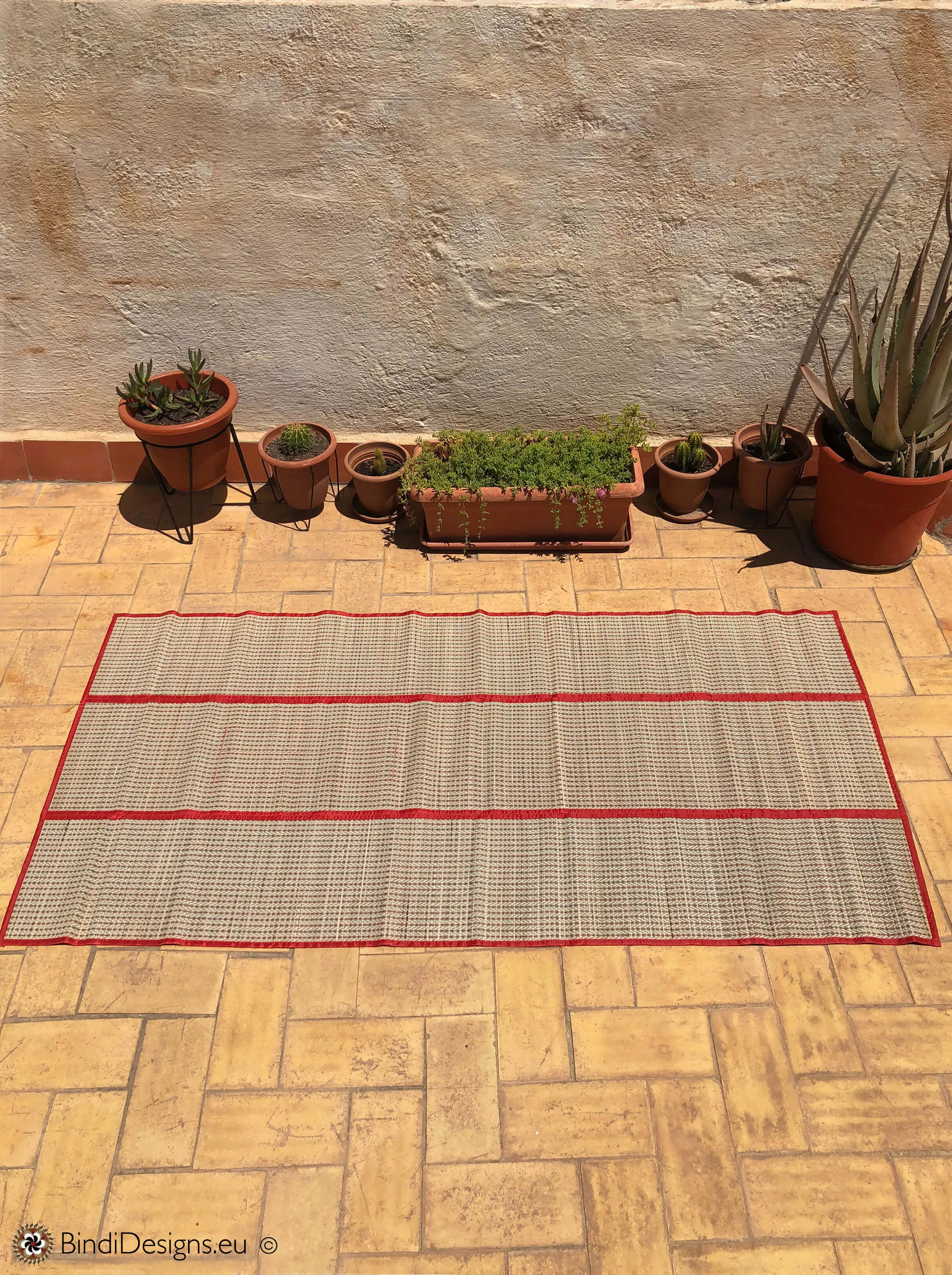 Handwoven Natural Reed Fold up Mat with Red Trim