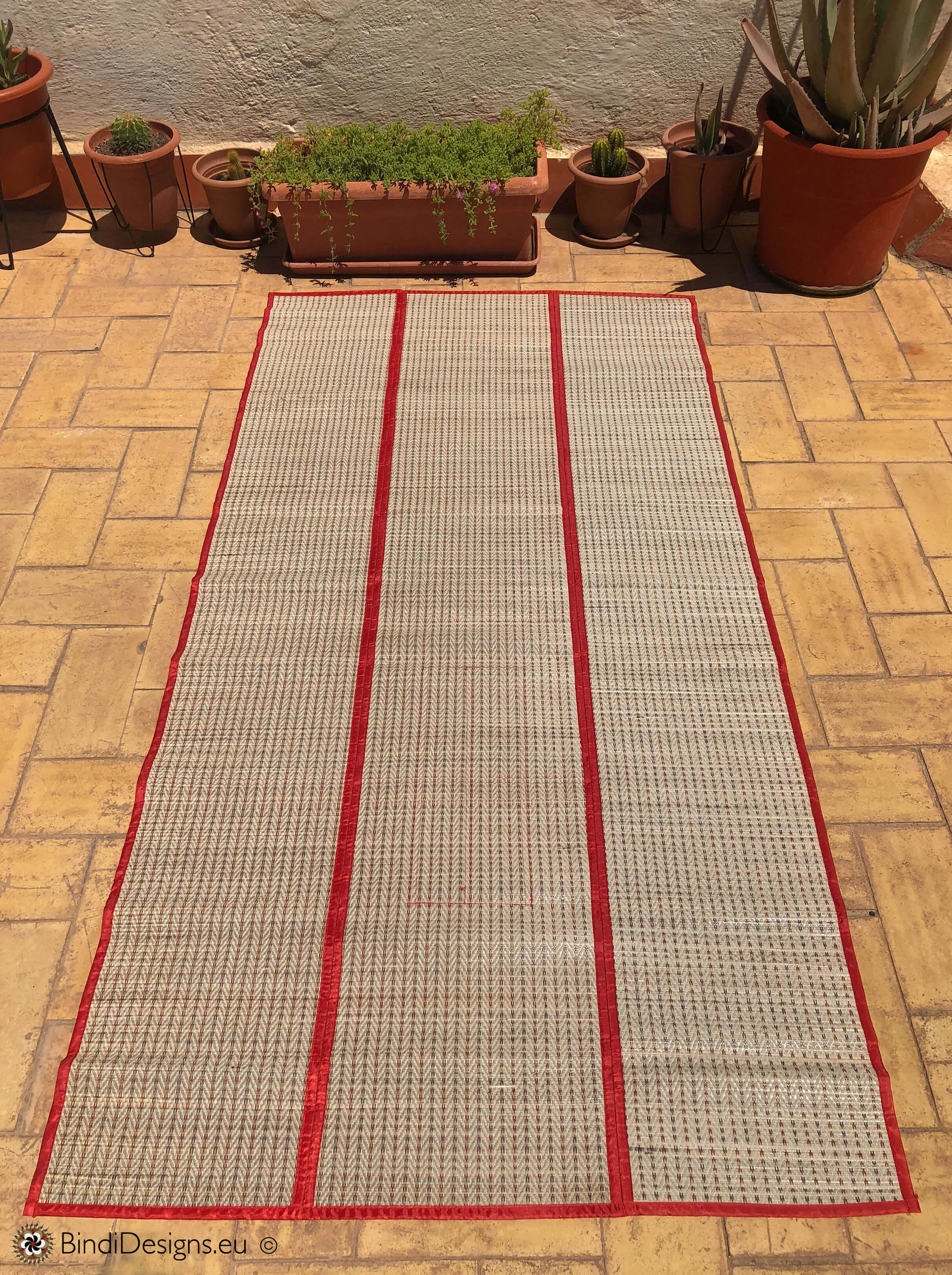 Handwoven Natural Reed Fold up Mat with Red Trim